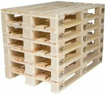 Heavy-duty pallet manufacturing and structural assembly area showing wood joinery